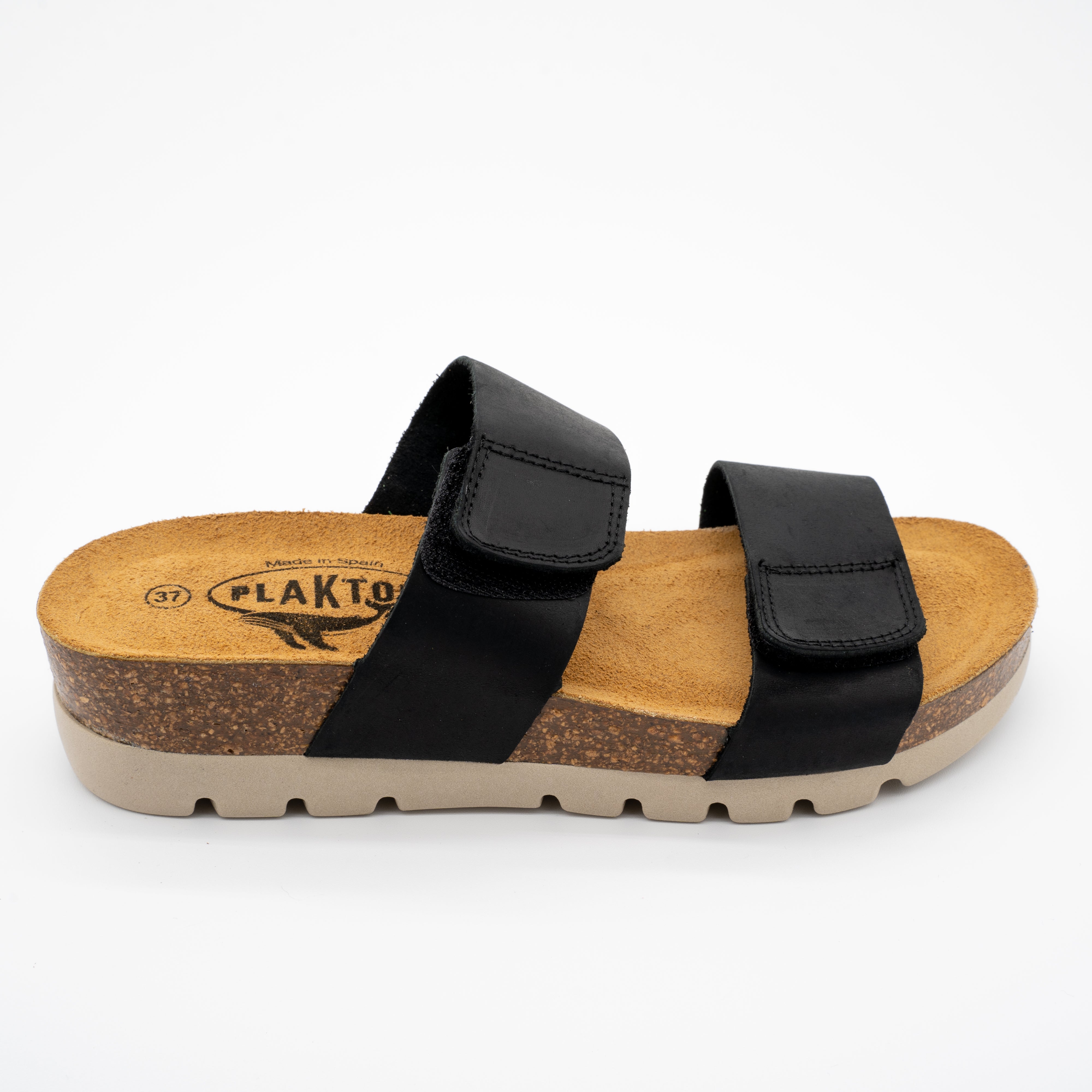 Black Plakton Cult sandal with two wide leather straps featuring Velcro closures, cork and Memory Foam footbed, and a beige lightweight sole.