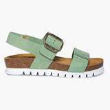 Side view of Plakton Condor platform sandals for women in mint green nubuck leather, featuring a thick natural cork platform sole and two wide straps with large adjustable silver buckles.