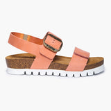 A side profile of the Condor sandal in Peach Nubuck, highlighting its thick platform sole composed of layers of sustainable Spanish cork. The warm, peach-toned leather straps provide a soft, velvety contrast to the stacked organic cork base, all supported by a durable white ripple outsole for a modern, grounded lift.