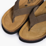 A pair of men's Acide sandals in Khaki nubuck. This angle highlights the wide, handmade leather straps and the contoured, natural grain cork footbed designed for anatomical comfort.