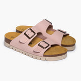 A pair of Beta sandals in Salmon Nubuck, angled to reveal the deep heel cups and the smooth, hand-finished curves of the cork base. The dual adjustable straps feature brushed metallic buckles, resting atop a plush tan suede lining that highlights the signature Plakton "Nature’s Hug" comfort.