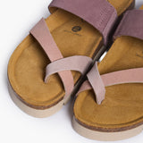 Looking directly down into the Bloom footbeds, showcasing the natural width of the cork base and the prominent "Plakton Memory Cushion" branding at the heel. The multi-pink suede straps frame the hand-sculpted contours, illustrating a design built for anatomical support and a secure fit.