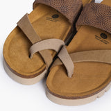 An overhead view looking directly into the Bloom footbeds. The image captures the natural width of the cork base and the prominent "Plakton Memory Cushion" branding at the heel. The multi-tan suede straps frame the hand-sculpted contours, illustrating a design built for anatomical support.
