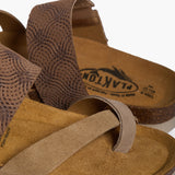 An extreme close-up of the Bloom’s upper, focusing on the rich, fibrous texture of the Multi-Tan suede. The shot highlights the precise stitching and the subtle shift between the neutral layers, while the soft-focus background shows the porous Spanish cork, reinforcing its premium handcrafted heritage.