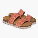 A pair of women's Plakton Brynn suede sandals in peach pink, showcasing the double-strap design with embossed floral details and a contoured cork footbed for arch support.