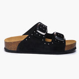 A side view of the Plakton CP Beta bio-sandal for women in black suede, featuring silver stud detailing along the straps and two large adjustable silver buckles on a contoured natural cork sole.
