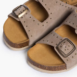 An overhead view looking into the CP Beta footbeds, where the biologically contoured cork mimics the foot's natural shape. The taupe-grey studded straps frame the "Plakton Memory Cushion" branding, illustrating a design that balances contemporary style with the timeless support of sustainable materials.
