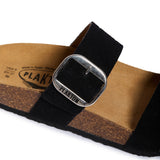 Black sandal with cork sole and 'Plakton' buckle on a white background